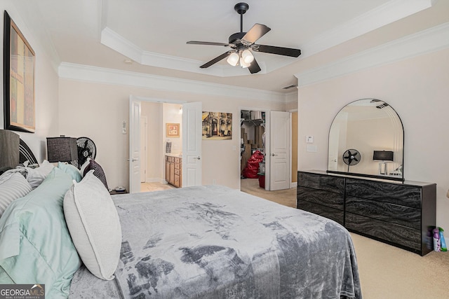 4445 Vanadium Bnd, Cumming, GA 30040 - bedroom with light carpet, a tray ceiling, crown molding, a walk in closet, and ceiling fan