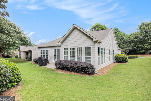 4445 Vanadium Bnd, Cumming, GA 30040 - back of property featuring a yard and a patio