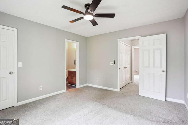 2049 Charter Ln, Lithonia, GA 30058 - unfurnished bedroom with carpet flooring, ensuite bath, and a ceiling fan