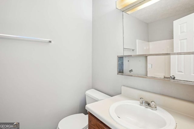 2049 Charter Ln, Lithonia, GA 30058 - bathroom featuring toilet and vanity