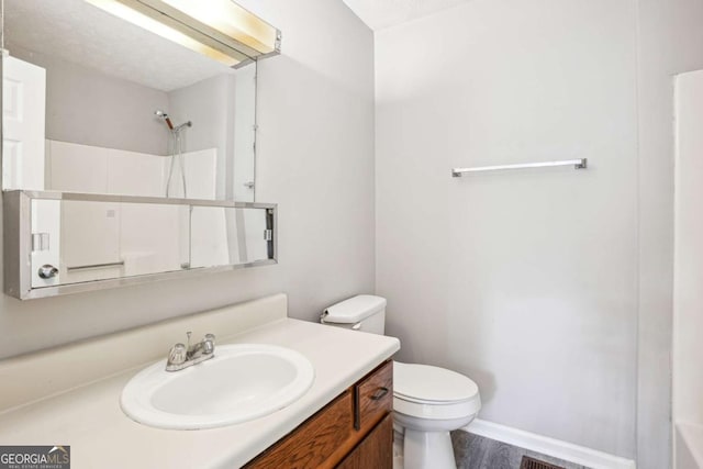 2049 Charter Ln, Lithonia, GA 30058 - full bath with vanity, a shower, and wood finished floors