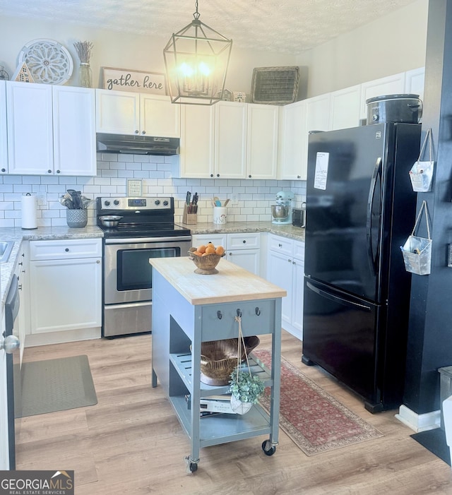 4863 Beacon Ridge Ln, Flowery Branch, GA 30542 - kitchen featuring stainless steel appliances, under cabinet range hood, tasteful backsplash, white cabinets, and light wood-type flooring