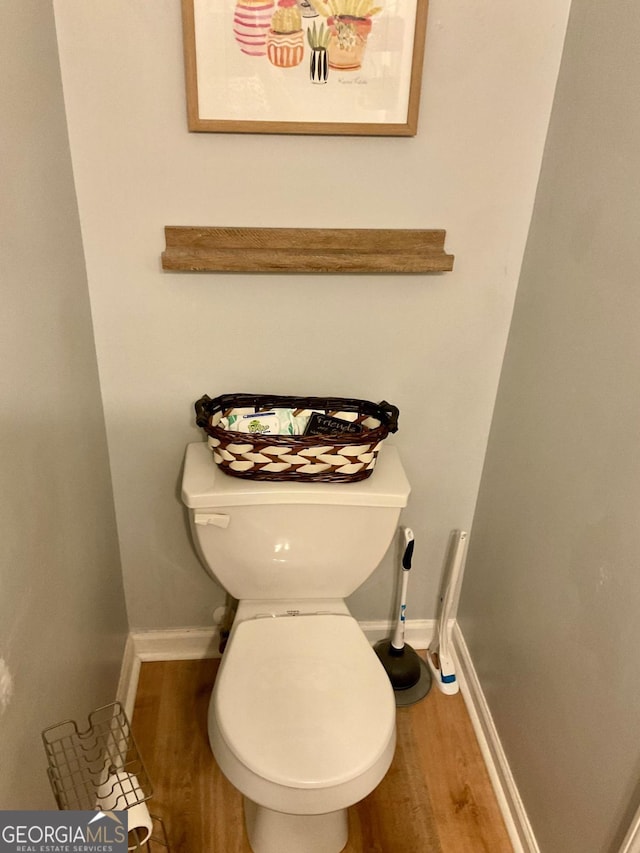 4863 Beacon Ridge Ln, Flowery Branch, GA 30542 - bathroom featuring wood finished floors, toilet, and baseboards