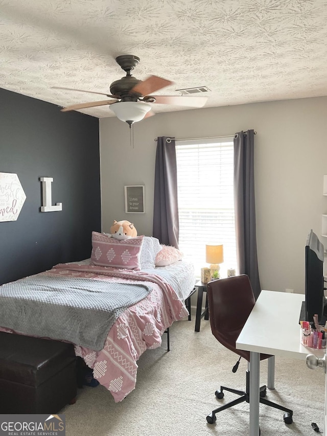 4863 Beacon Ridge Ln, Flowery Branch, GA 30542 - carpeted bedroom featuring a desk, a textured ceiling, and ceiling fan