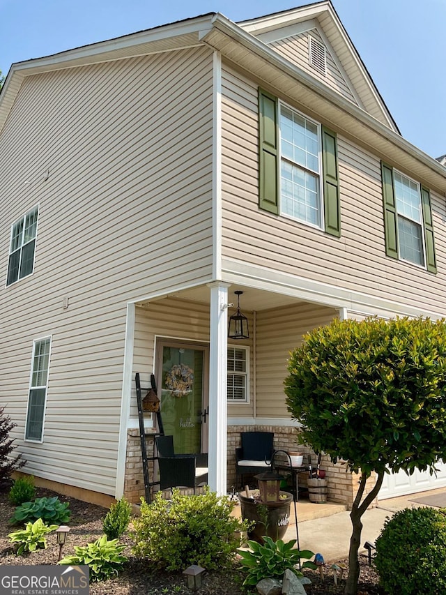4863 Beacon Ridge Ln, Flowery Branch, GA 30542 - view of side of property with a patio area