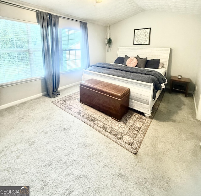 4863 Beacon Ridge Ln, Flowery Branch, GA 30542 - carpeted bedroom with baseboards and lofted ceiling