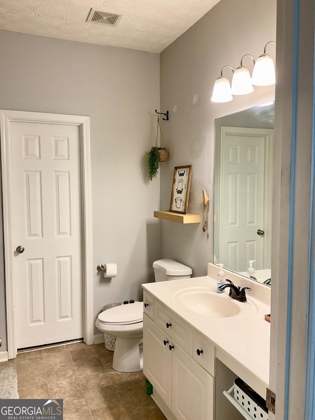 4863 Beacon Ridge Ln, Flowery Branch, GA 30542 - bathroom with vanity, toilet, and baseboards