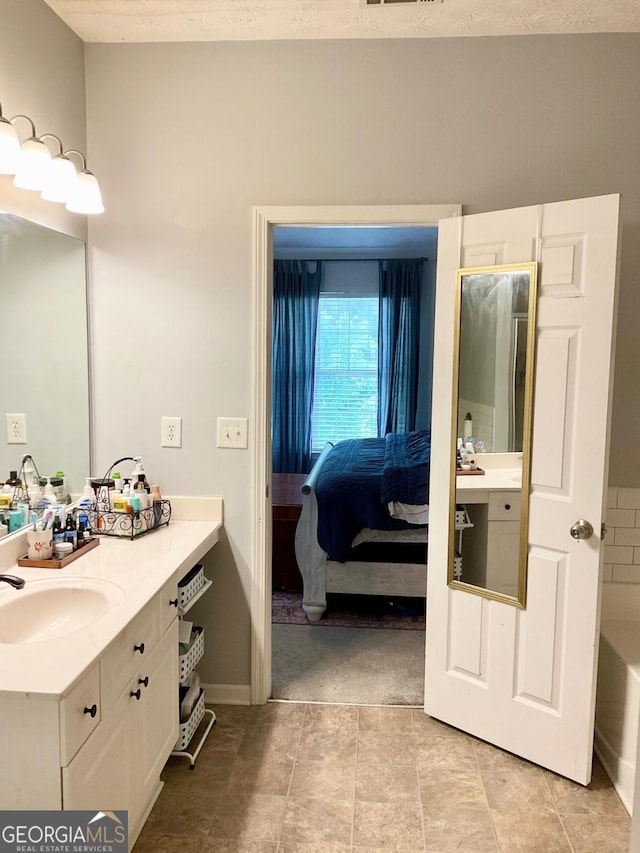 4863 Beacon Ridge Ln, Flowery Branch, GA 30542 - ensuite bathroom featuring vanity and a tub