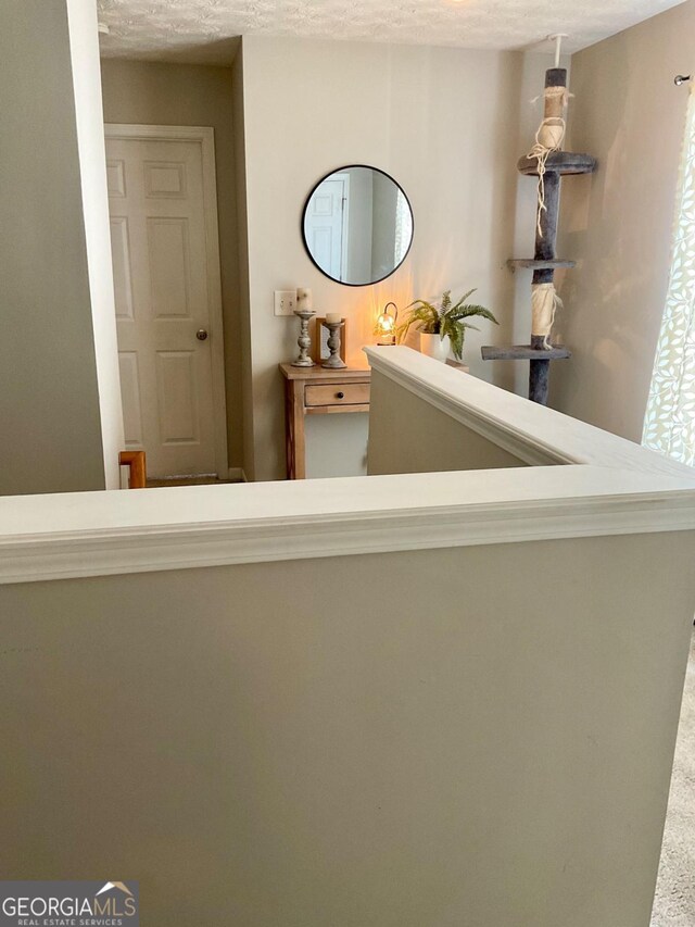 4863 Beacon Ridge Ln, Flowery Branch, GA 30542 - hallway with a textured ceiling