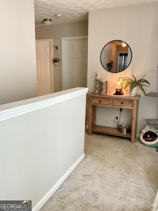 4863 Beacon Ridge Ln, Flowery Branch, GA 30542 - corridor with carpet floors, a textured ceiling, and baseboards