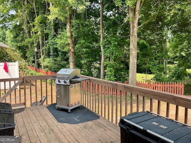 4863 Beacon Ridge Ln, Flowery Branch, GA 30542 - wooden deck featuring area for grilling and view of wooded area