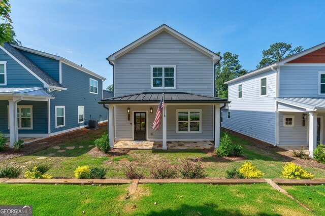 663 Oglethorpe Ave, Athens, GA 30606 - view of front facade with covered porch, a standing seam roof, a metal roof, and a front yard