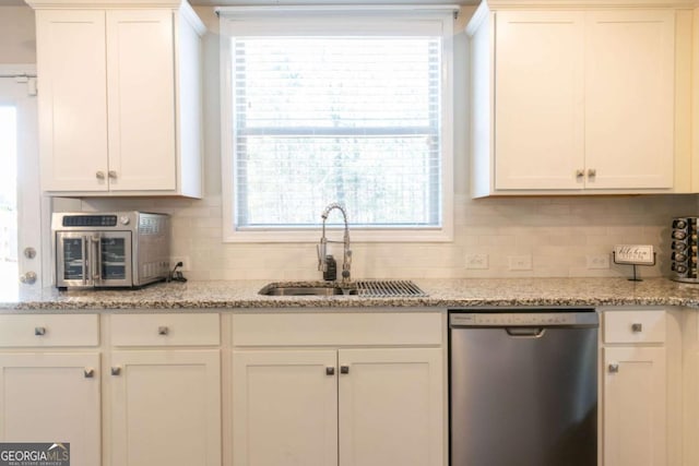 3126 Cove View Ct, Dacula, GA 30019 - kitchen featuring dishwasher, decorative backsplash, and white cabinetry