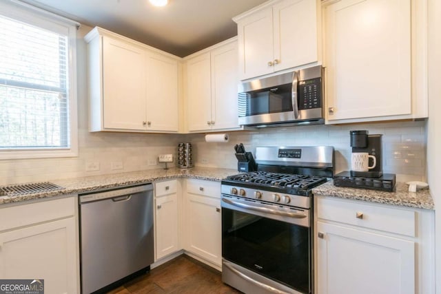 3126 Cove View Ct, Dacula, GA 30019 - kitchen featuring stainless steel appliances, backsplash, and white cabinetry