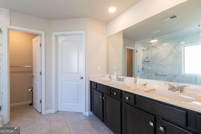 3126 Cove View Ct, Dacula, GA 30019 - bathroom featuring a marble finish shower, double vanity, and tile patterned floors