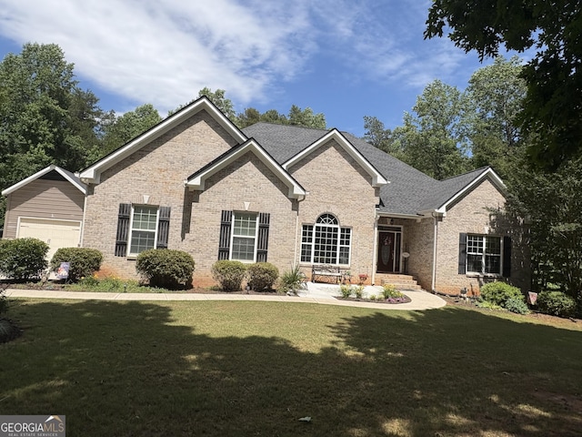 219 Periwinkle Way, Pendergrass, GA 30567 - view of front of home with brick siding and a front lawn