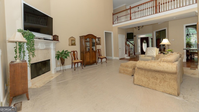 219 Periwinkle Way, Pendergrass, GA 30567 - living room with a towering ceiling, a fireplace, and baseboards