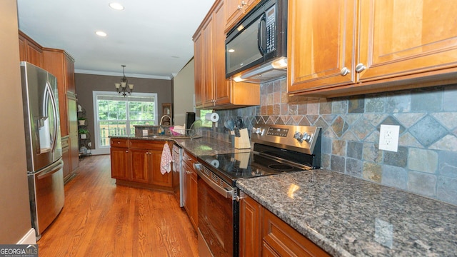 219 Periwinkle Way, Pendergrass, GA 30567 - kitchen with appliances with stainless steel finishes, brown cabinetry, light wood-style flooring, crown molding, and a sink