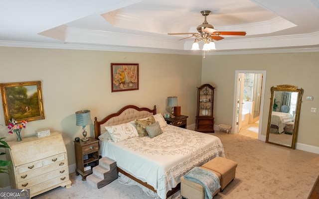 219 Periwinkle Way, Pendergrass, GA 30567 - bedroom featuring a tray ceiling, ornamental molding, light carpet, connected bathroom, and a ceiling fan