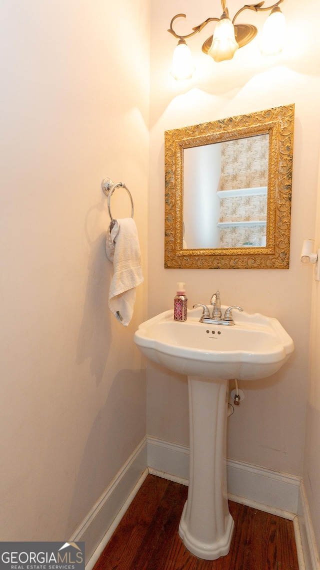 219 Periwinkle Way, Pendergrass, GA 30567 - bathroom featuring baseboards, wood finished floors, and a sink