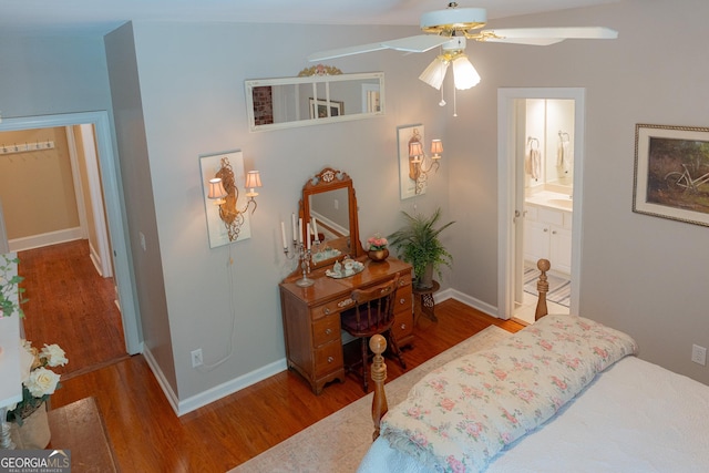 219 Periwinkle Way, Pendergrass, GA 30567 - bedroom featuring wood finished floors, baseboards, ensuite bath, and ceiling fan