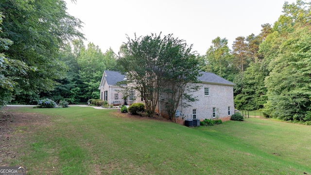 219 Periwinkle Way, Pendergrass, GA 30567 - view of home's exterior featuring brick siding and central AC unit