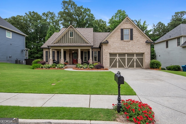 2059 Ivey Chase Dr, Dacula, GA 30019 - craftsman-style house featuring brick siding, covered porch, a garage, and a front yard
