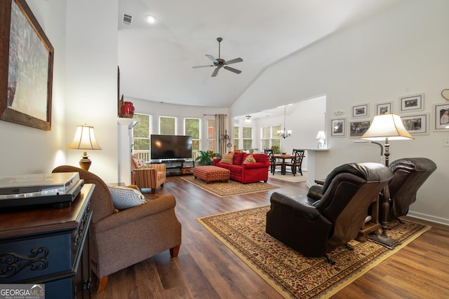 2059 Ivey Chase Dr, Dacula, GA 30019 - living room with ceiling fan, high vaulted ceiling, wood finished floors, and a chandelier