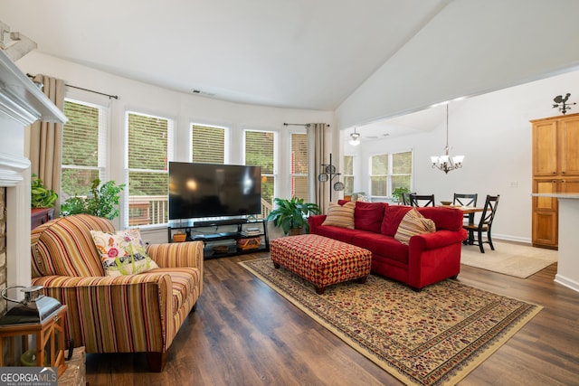 2059 Ivey Chase Dr, Dacula, GA 30019 - living area featuring plenty of natural light, a chandelier, dark wood finished floors, and vaulted ceiling