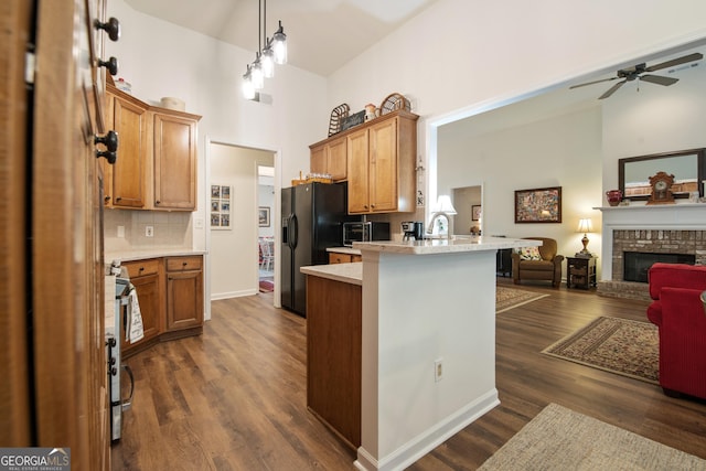 2059 Ivey Chase Dr, Dacula, GA 30019 - kitchen featuring open floor plan, a high ceiling, ceiling fan, light countertops, and black refrigerator with ice dispenser
