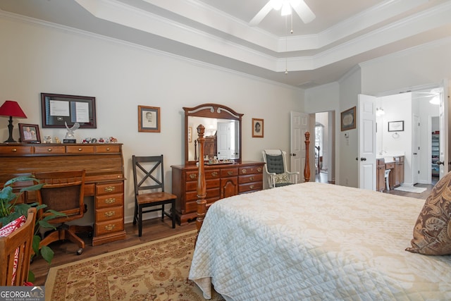 2059 Ivey Chase Dr, Dacula, GA 30019 - bedroom with wood finished floors, a tray ceiling, ornamental molding, and a ceiling fan