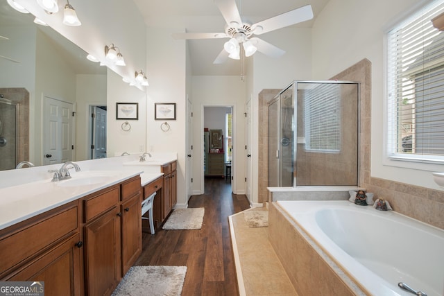 2059 Ivey Chase Dr, Dacula, GA 30019 - bathroom featuring a shower stall, double vanity, a garden tub, and plenty of natural light