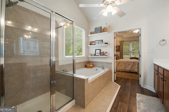 2059 Ivey Chase Dr, Dacula, GA 30019 - ensuite bathroom with vanity, wood finished floors, a bath, ceiling fan, and healthy amount of natural light
