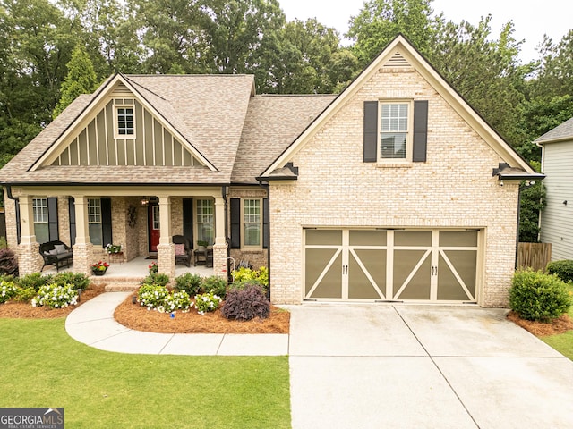 2059 Ivey Chase Dr, Dacula, GA 30019 - craftsman house featuring covered porch, roof with shingles, concrete driveway, and brick siding