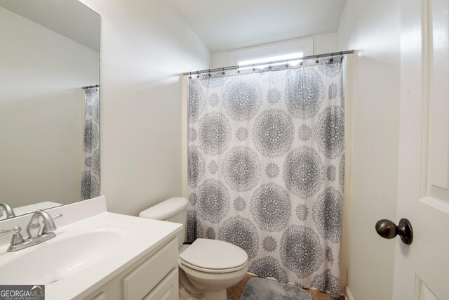 2059 Ivey Chase Dr, Dacula, GA 30019 - bathroom featuring vanity, toilet, and curtained shower