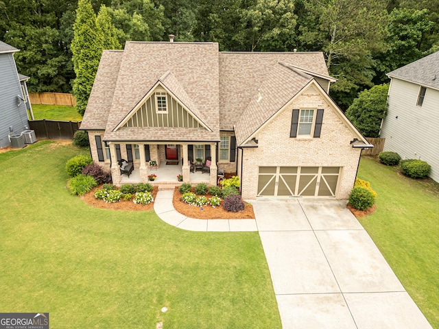 2059 Ivey Chase Dr, Dacula, GA 30019 - craftsman-style house featuring roof with shingles, concrete driveway, brick siding, and a porch