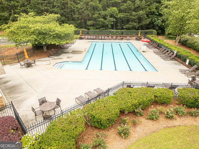 2059 Ivey Chase Dr, Dacula, GA 30019 - community pool featuring a patio area