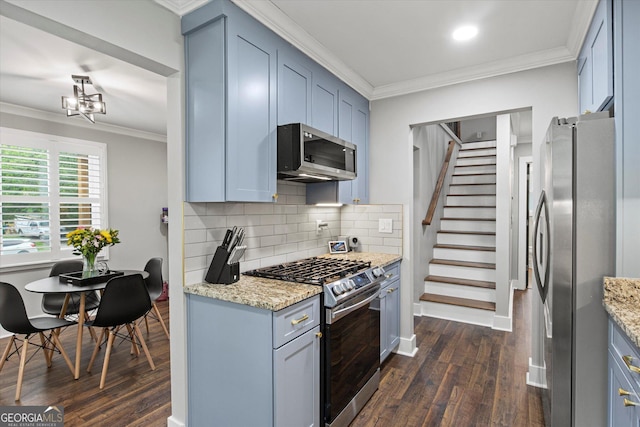 528 Allendale Dr, Decatur, GA 30032 - kitchen featuring appliances with stainless steel finishes, dark wood-style flooring, crown molding, tasteful backsplash, and light stone countertops