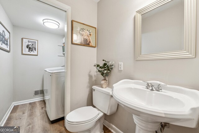 1720 Little Willeo Rd, Marietta, GA 30068 - bathroom with washer / clothes dryer and wood finished floors