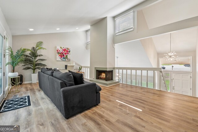 1720 Little Willeo Rd, Marietta, GA 30068 - living room featuring a chandelier, high vaulted ceiling, wood finished floors, plenty of natural light, and recessed lighting