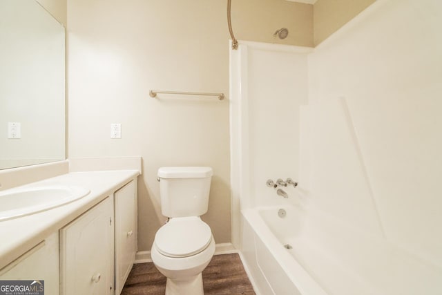 113 Lisa Ln, Carrollton, GA 30117 - full bath with toilet, vanity,  shower combination, wood finished floors, and baseboards