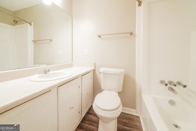 113 Lisa Ln, Carrollton, GA 30117 - full bath with toilet, vanity, wood finished floors, tub / shower combination, and baseboards