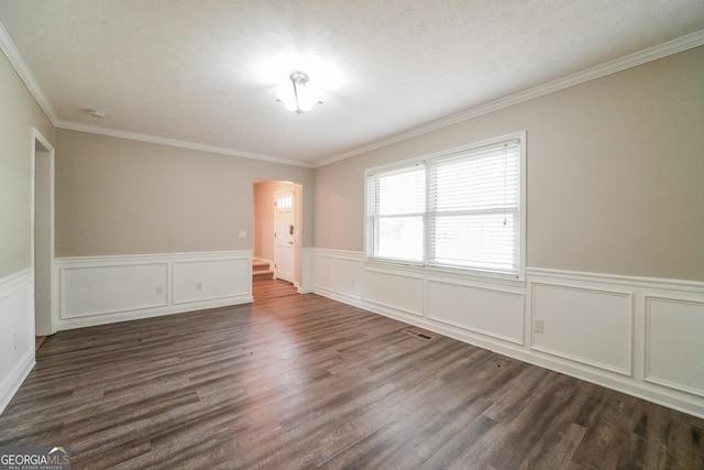 113 Lisa Ln, Carrollton, GA 30117 - spare room featuring dark wood-type flooring, ornamental molding, and wainscoting