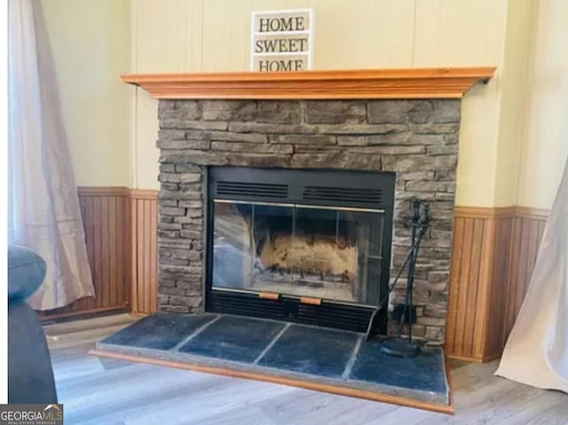 1909 Scotland Rd, Dublin, GA 31021 - detailed view of a fireplace, wood finished floors, and a wainscoted wall