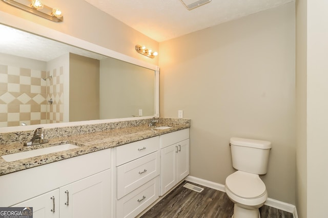 2624 Windridge Dr, Acworth, GA 30102 - full bath with double vanity, wood finished floors, and tiled shower