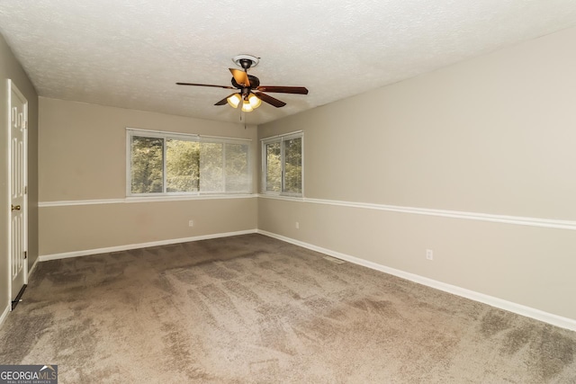 2624 Windridge Dr, Acworth, GA 30102 - empty room with ceiling fan, carpet, and a textured ceiling