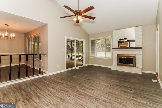 2624 Windridge Dr, Acworth, GA 30102 - unfurnished living room with ceiling fan, wood finished floors, a chandelier, and high vaulted ceiling