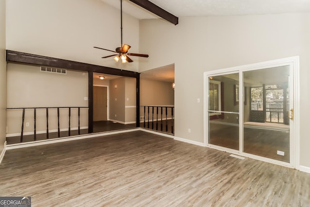 2624 Windridge Dr, Acworth, GA 30102 - spare room featuring wood finished floors, a ceiling fan, beamed ceiling, and high vaulted ceiling