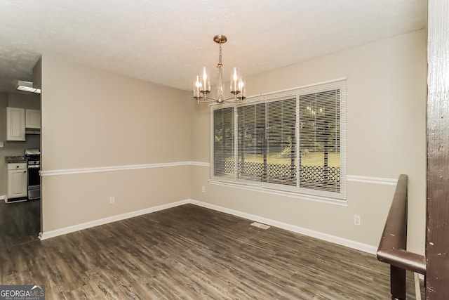 2624 Windridge Dr, Acworth, GA 30102 - unfurnished dining area featuring a chandelier and dark wood-style flooring