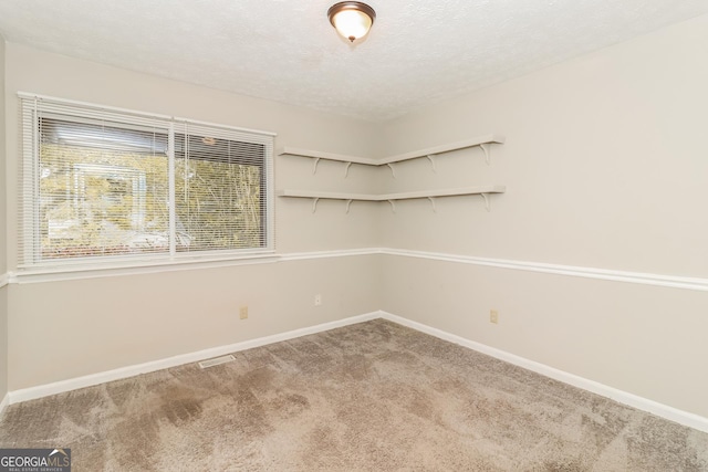 2624 Windridge Dr, Acworth, GA 30102 - carpeted empty room featuring a textured ceiling and baseboards